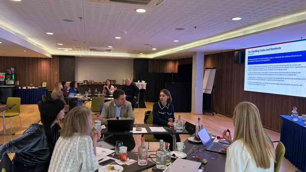 Participants discussing in groups during the training